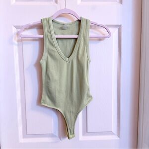 Green ribbed dynamic bodysuit